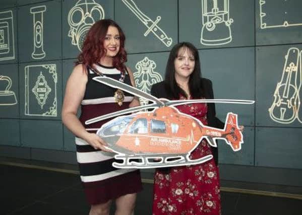 Outgoing Mayor of Mid and East Antrim, Councillor Lindsay Millar with Michelle McDaid from the Air Ambulance NI.