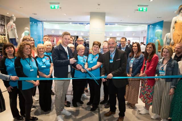 Neale Kirk, ISE Regional lead and Brendan Wallace, store manager, cutting the ribbon at the official opening of the store.