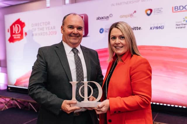 Alan Lowry, managing director of ESF,  receiving the Innovation Director of the Year  award from Ashleen Feeney, director at KPMG, category sponsor.