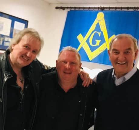 From left to right, Martin Jarvis, music promoter; Steve Strange, Snow Patrol's promoter from Carrickfergus and W. Bro Jim McCord.