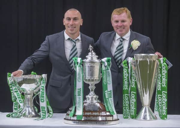 Celtic's Scott Brown (left) with manager Neil Lennon (right) celebrate with the trophy for winning the Treble Treble during the William Hill Scottish Cup Final at Hampden Park, Glasgow. PRESS ASSOCIATION Photo. Picture date: Saturday May 25, 2019.