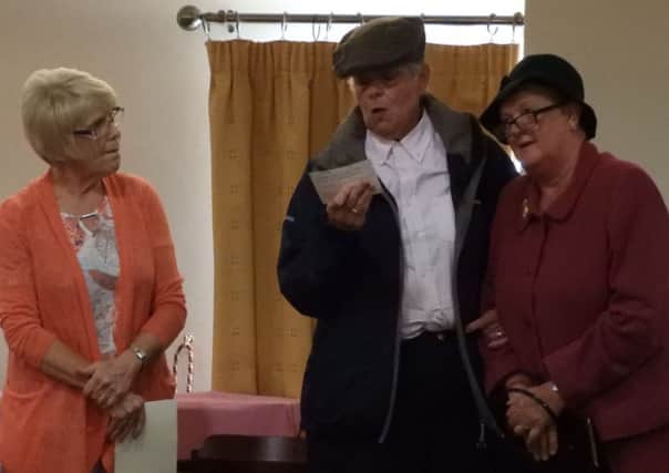 Pictured taking part in a sketch at Muckamore WI Drama Group's evening of Light Entertainment to raise funds for the  Air Ambulance
Northern Ireland charity are Elizabeth Gray, Ruth Wilson and Joan Gray. Over 200 guests attended the event.