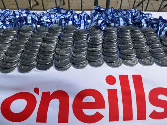 The Walled City Marathon medals at the finishing line.