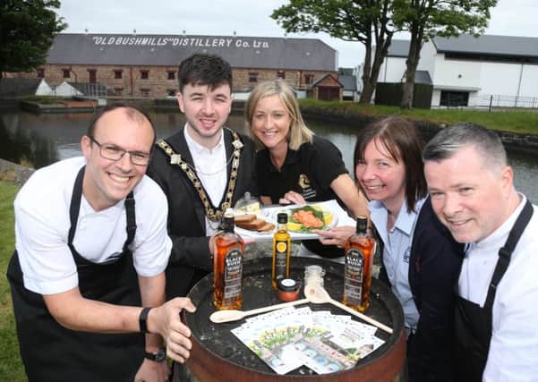 Mayor of Causeway Coast and Glens Borough Council Councillor Sean Bateson is joined by celebrity chef Ian Orr from Browns Bonds Hill Group, Sharon Scott from Taste Causeway, Joanna Morrow from Bushmills Distillery and Gary Stewart from Tartine Restaurant to mark the return of Bushmills Salmon and Whiskey Festival this weekend