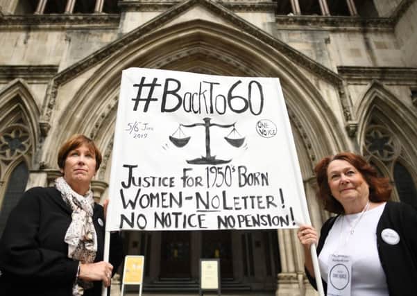 Anne Taylor (left) and Patsy Franklin from the campaign 'Back to 60' outside the Royal Courts of Justice in central London, ahead of the first day of a landmark legal case against the Government brought by women affected by the state pension age increase. Pic: Stefan Rousseau/PA Wire