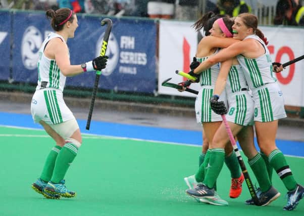 Bethany Barr mobbed by team-mates following a goal for Ireland on her major tournament debut during Saturday's defeat of Malaysia in Banbridge