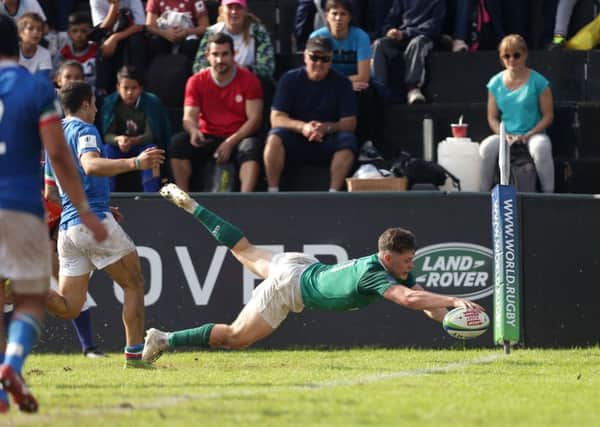 Ireland's Rob Russell scores a try
 against Italy