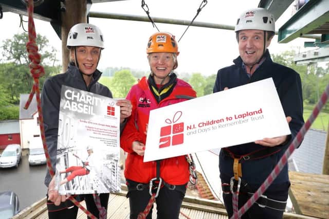 Jim Burke and Lorraine Weir from Hagan Homes in training with Nicola Campbell at Belfast Activity Centre for the Adventure Abseil on Sunday, June 23 at the Europa Hotel in aid of NI Children to Lapland and Days to Remember Trust. Photo by  Philip Magowan /  Press Eye.