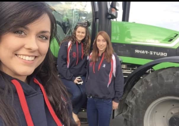 Lois Bingham, Rachael McMinn and Victoria McCabe pictured outside a Deutz Fahr from G.A Allen Machinery the sponsors for this years Treasure hunt and BBQ