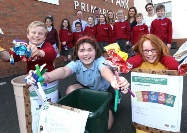 Members of the Eco Council at Pond Park Primary School show Alderman James Baird, Chairman of Lisburn & Castlereagh City Council's Environmental Sevices Committee their recycling efforts that will save the school up to £2,000 per year.  Also pictured are teachers from the school and the Principal Mr Cherry.