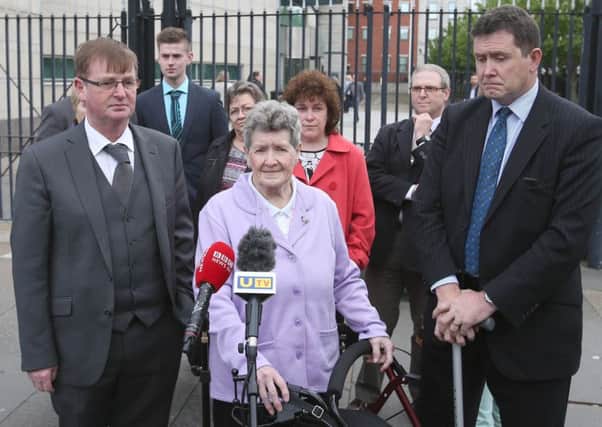 Willie Frazer, Beatrice Worton and her son Colin Worton outside  the opening of the Kingsmills Massacre inquest in May 2016. Photo: Matt Mackey / Press Eye