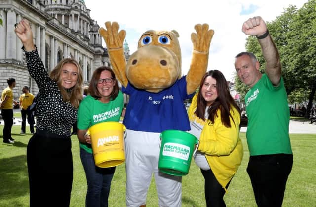Mark Tumelty (right), branch manager of Ulster Bank in Lisburn, celebrates the charity campaign success along with (l-r) Q Radios Cate Conway, Joanne Young (Macmillan). Henry Hippo and Michelle Byrne from AWARE.