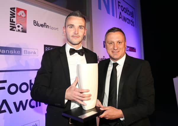 The Bluefin Sport 
Premier Intermediate League 'Player of the Year' winner, 
Ryan McCready from Queen's University, with NIFL managing director Andrew Johnston at the end-of-season awards. Pic by PressEye Ltd.