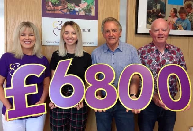 Pictured during the cheque presentation are Elaine Brannigan (Business Development Manager, Cruse NI), Holly Neill, her dad David Neill and Paul Finnegan (Director, Cruse Bereavement Care NI)