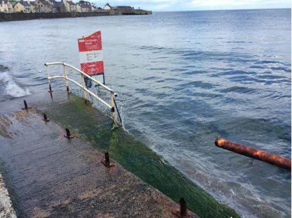 The sign erected by Mid and East Antrim Borough Council at Carnlough seafront.