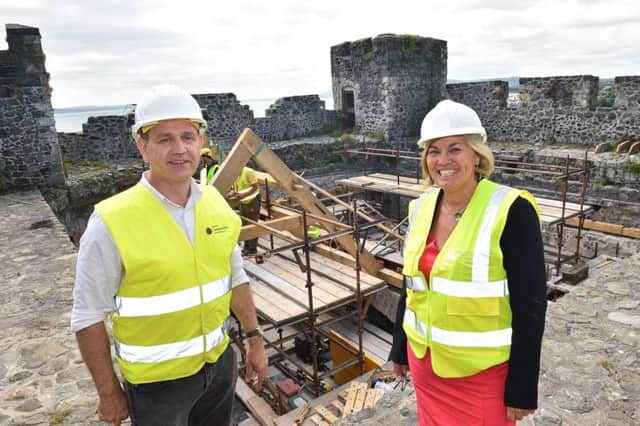 Tracy Meharg, Permanent Secretary, Department for Communities and Principal Inspector of Historic Monuments Dr. John OKeefe, department for Communities on the roof of Carrick Castle. Pics by Simon Graham Photography.