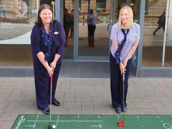 Judith Ball and Lynn Mackey, Store Directors at Coleraine Specsavers getting into the swing of things ahead of The 148th Open at nearby Royal Portrush