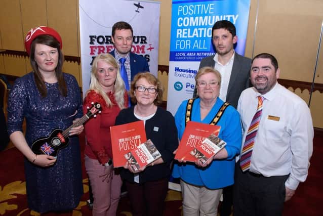 L-R: Katie Carr, musician; Vivienne Walsh, Mid & East Antrim Investment & Funding Delivery manager; Tomasz Tadla, Deputy Consul for the Republic of Poland (Belfast); Mairead Myles Davy, Area manager Housing Executive;  the Deputy Mayor, Cllr Beth Adger MBE;  Maciek Bator, For Your Freedom and Ours Programme director and Stephen Gamble, Housing Executive.