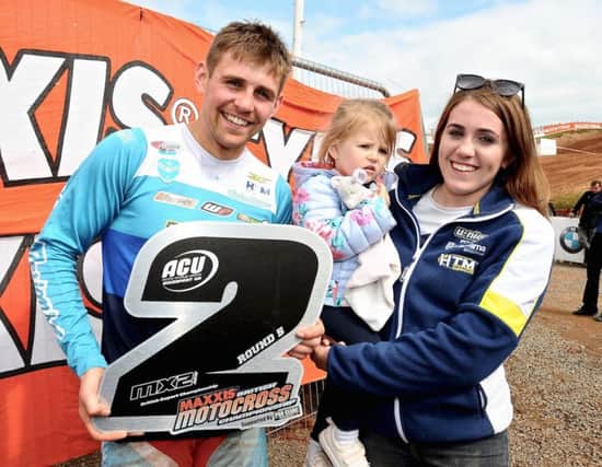 Glenn McCormick pictured with his sister Chloe and daughter Lacey after picking up his trophy for second place in the Experts MX2 class.