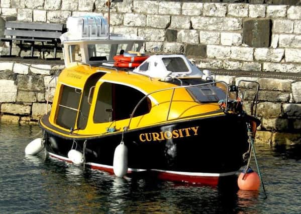 'Curiosity' moored at Carnlough Harbour.