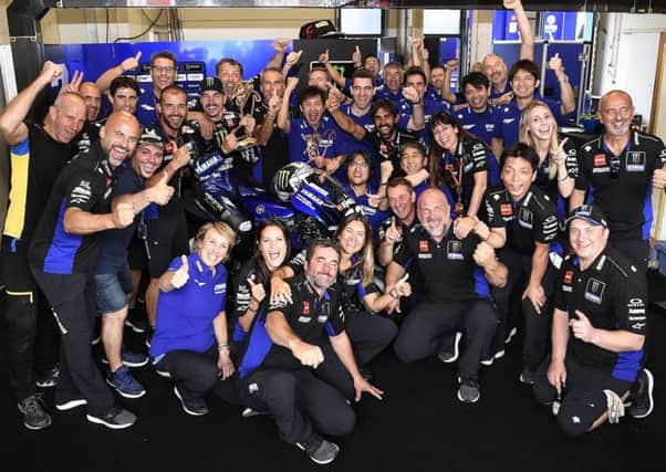 Mavereck Vinales celebrates his Assen victory with his Monster Yamaha team.