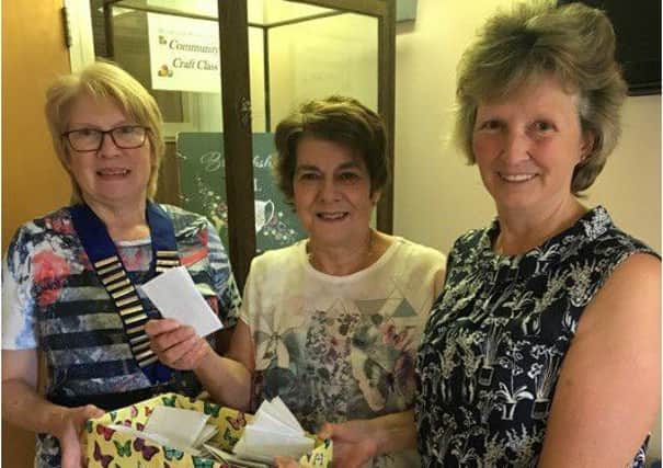 President of Broughshane WIMartha Wilson with Sophia Maybin Slemish Area Executive and Sally Armstrong Correspondence Secretary. Sophia made the draw for the Slemish Area WI fireside quiz.