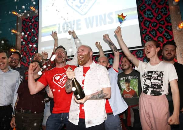Members of the LGBT community celebrate at the Maverick bar, Belfast, as same-sex marriage in Northern Ireland came a step closer after MPs voted to legalise it if a new Stormont Executive is not formed by October. Photo: Peter Morrison/PA Wire