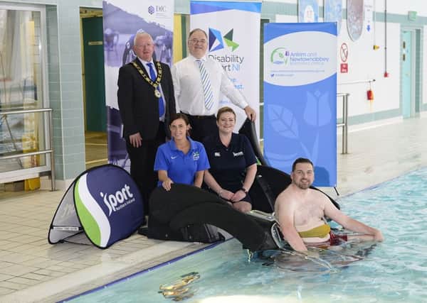 (L-R) Mayor of Antrim and Newtownabbey, Alderman John Smyth; Robert Heyburn, Department for Communities; Andrea Herron from Disability Sport NI; Jayne Moore from Sport NI and local resident Gareth McNeilly launch the Poolpod at Antrim Forum