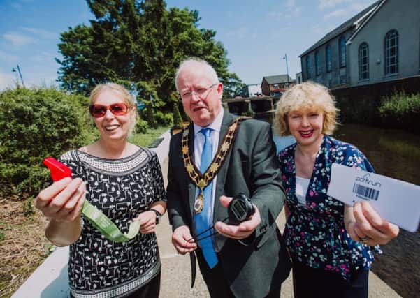 Mayor of Antrim and Newtownabbey, Alderman John Smyth is joined by Vivien Davidson, parkrun volunteer 
and Nicola Ardbuckle, Northern Health & Social Care Trust to launch the Ballyclare parkrun