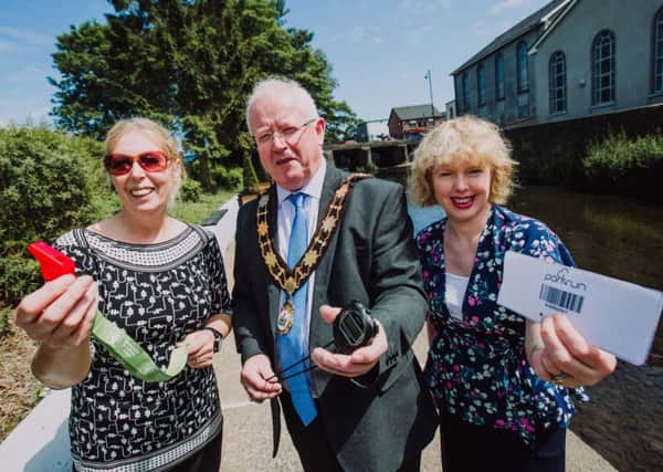 Mayor of Antrim and Newtownabbey, Ald John Smyth is joined by Vivien Davidson, parkrun volunteer and Nicola Ardbuckle, Northern Health and Social Care Trust to launch the Ballyclare parkrun