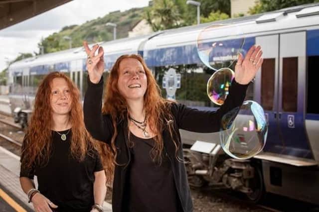 Whitehead Food and Folk Festival has teamed up with Translink to encourage visitors to take advantage of summer travel discounts. Demonstrating some of the attractions are the festivals Karen and Claire Gibson.