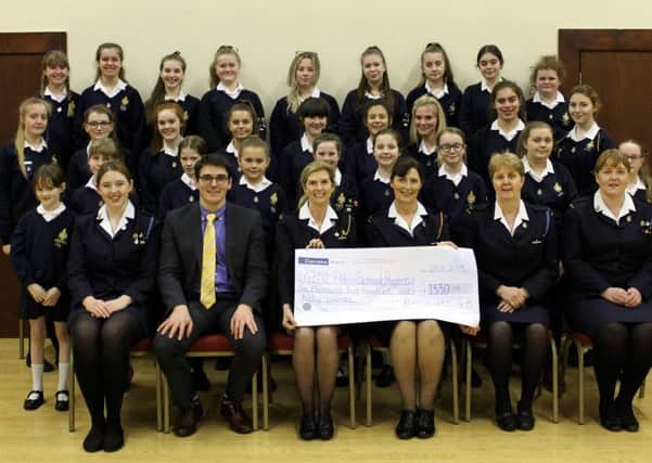 Ballywatt GB Company section presents the giant cheque for the Uganda School Project to Heather Sweet, GBNI Vice President. [photograph by Kirsty Caldwell]
