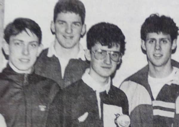 Fifth Carrickfergus Senior Cross Country Team receive their trophy from Jimmy Reid after wining the East Antrim Battallion BB senior cross country race. 1991.