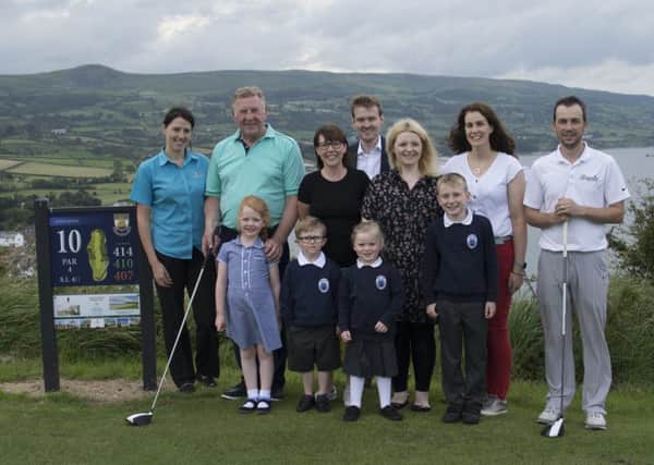 Olderfleet Primary's Parents Association are holding a stableford golf competition at Cairndhu Golf Club on September 1 in aid of school funds. Pictured are: Cairndhu Golf Club Members, P6 teacher Mrs Godfrey, parents from the PTA, pupils of Olderfleet Primary and two sponsors of the event -Kelly Lee Thompson of Inkpots Day Nursery and Matthew Scott of Independent Homes.