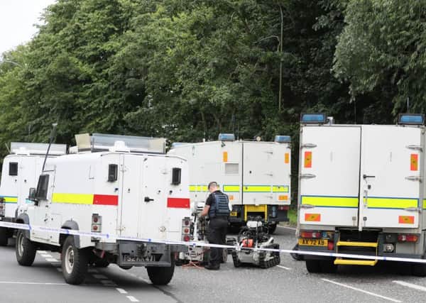 While a security operation was at Tullygally Road, Craigavon, above, responding to a dissident republican explosive device, PSNI officers were carrying out drugs searches in nearby Lurgan. Photo: Brian Lawless/PA Wire