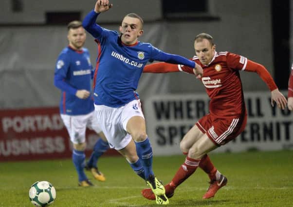 Gregg Hall (right) competing for Portadown against Linfield last season. Pic by INPHO.