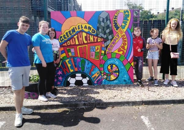 David Fee, Elizabeth Evans, Georgia Armstrong, Lewis Hunter, Kacey Brooks and Abigail Hillen at Greenisland Youth Centre's new mural.