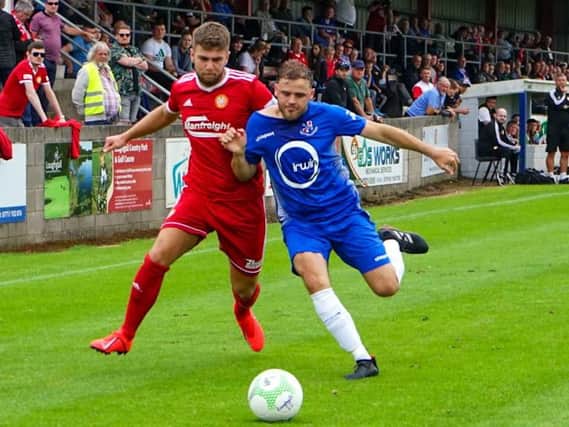 Portadown's Adam Salley (left) tussles with Fra Brennan of Loughgall on Saturday at Lakeview Park. Pic by Brian McStea.