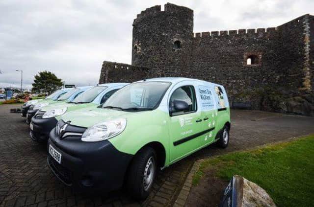 Green Dog Walker vans at Carrickfergus Castle.
