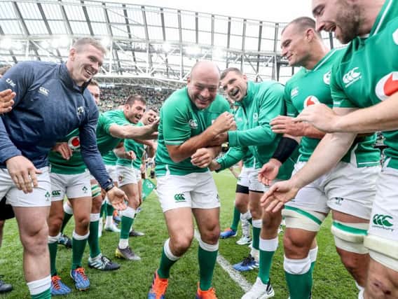 Rory Best is mobbed by his team mates after his last game in the Aviva Stadium