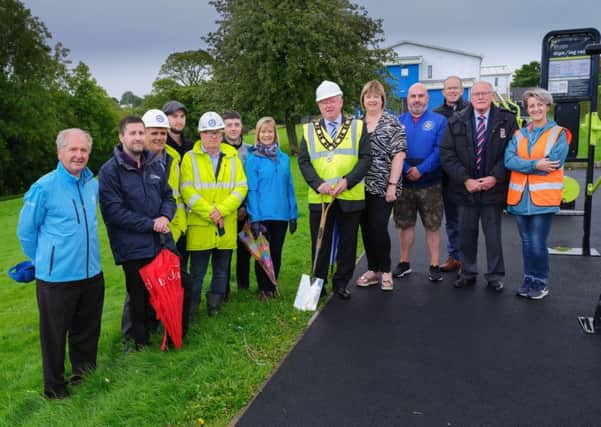 Mayor of Antrim and Newtownabbey, Alderman John Smyth pictured at the sod cutting ceremony of the new Council-led Environmental Improvement Scheme in Randalstown with local community, business and political representatives.