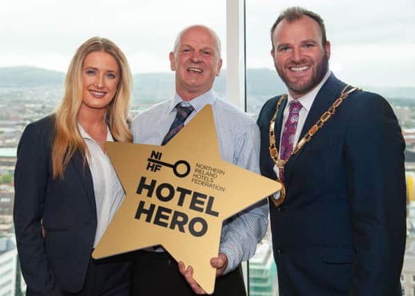 (L-R) Cheryl McCook and NIHF Hotel Hero Davy McMaster from Causeway Hotel with NIHF President Gavin Carroll