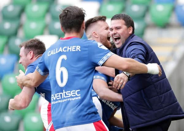 Linfield manager David Healy and his players celebrate late derby success over Glentoran. Pic by Pacemaker.