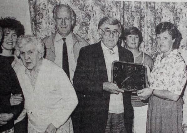 Harry Ramsay of Friends of Wilson House presents Senior Care Officer Sadie Davison with one of six clocks for the senior citizens at Wilson House.
1989