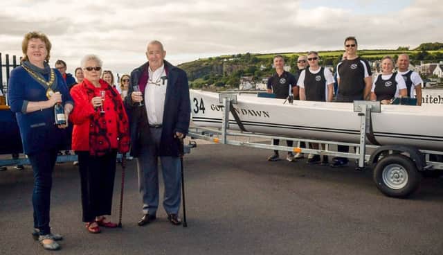 The Mayor, Cllr Maureen Morrow, Jean and John Kelly, former owners of the Golden Dawn café, with one of the two new boats.