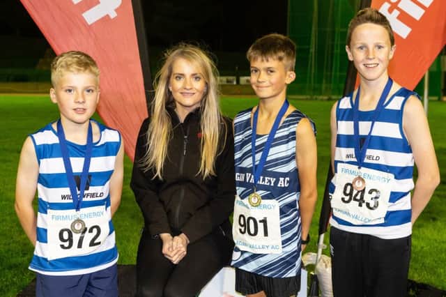 Scott Owen (middle) from Lagan Valley Athletics Club stormed to first place in the U13 1500m race with a time of 5.03.29. Pictured with Scott are Colm McKee (left) and Finn Cross (right) from Willowfield Harriers