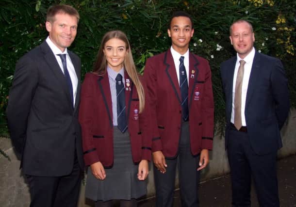 Head Girl and Head Boy, Jenna McCarlie and Matthew Clenaghan with guest of honour Simon McDowell and principal, Jonathan Wylie.
