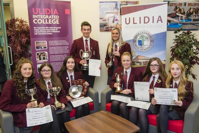 Ulidia prize winners proudly display their awards.