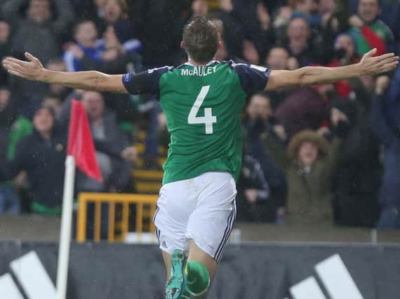 Gareth McAuley celebrates scoring against Azerbaijan