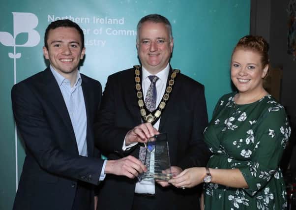 Daniel Christie and Kathryn Williamson, Christies Direct receive the award for E-Commerce Business of the Year from John Healy, President, Northern Ireland Chamber of Commerce and Industry